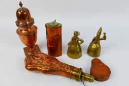 Copper and brass wares to include a powder flask, miner's watch protector,