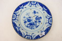 A Chinese blue and white plate, decorated with bamboo and peony, plate has old staple repair, 31.