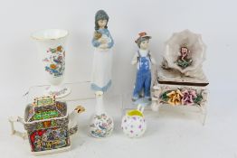 Lot to include a Lladro figure, one further Nao figure, two Wedgwood vases,