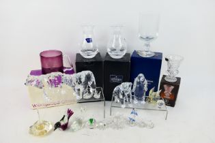 A collection of Swarovski style ornaments, animal form paperweights,