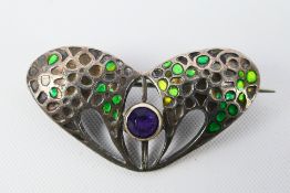 An Art Nouveau silver and enamel brooch by Charles Horner (losses to the enamel),