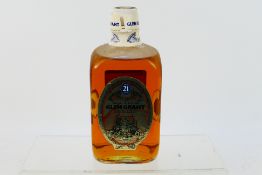A 26⅔ fl ozs bottle of Glen Grant 21 Years Old Director's Reserve, 80° proof,