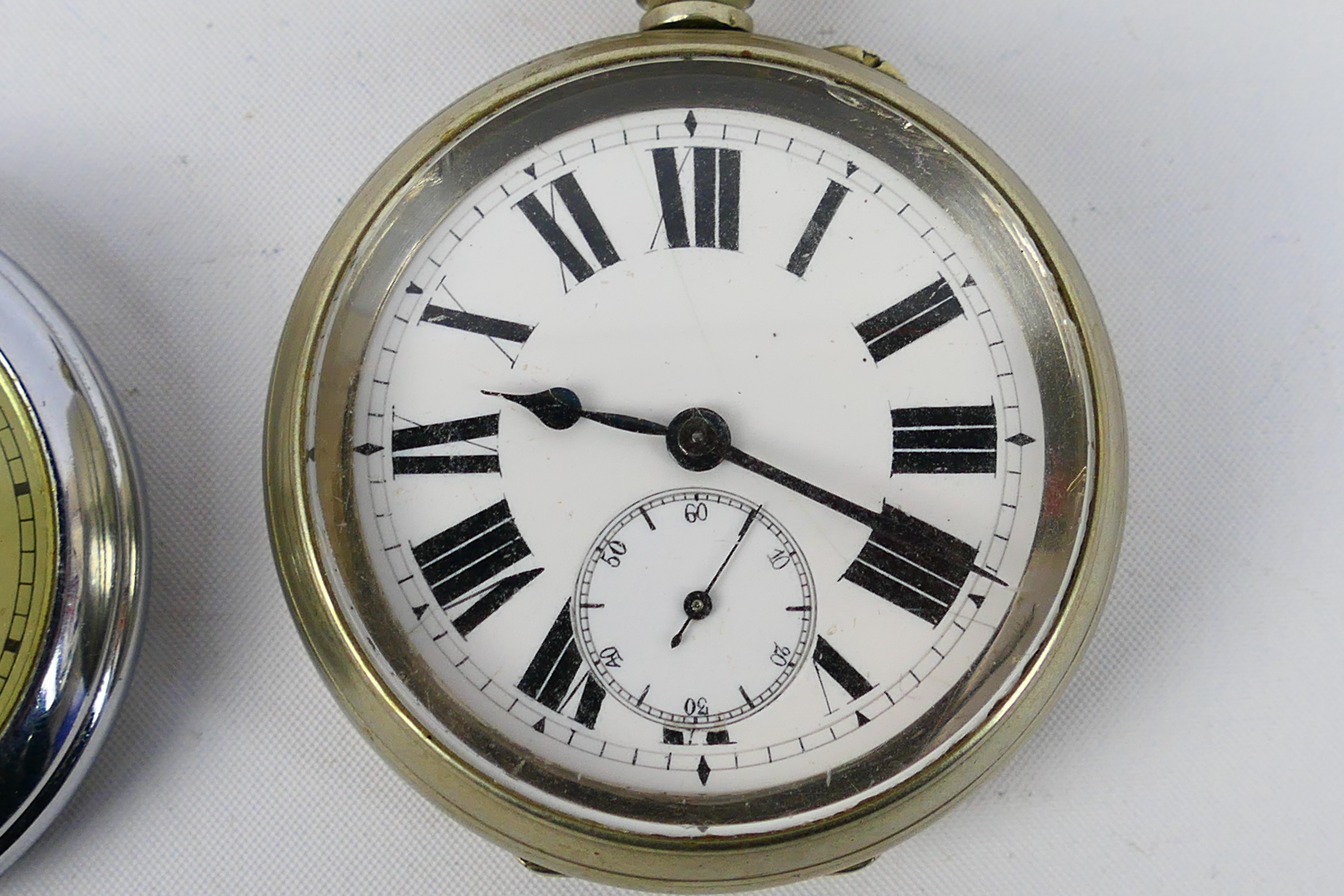 A white metal cased open face pocket watch with Roman numerals to a white enamel dial, - Image 3 of 7