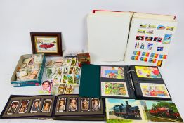 Lot to include an album of world stamps, rail related postcards, cigarette cards and other.