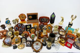 A large quantity of vintage sporting trophies.