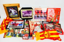 A collection of items relating to Manchester United to include publications,