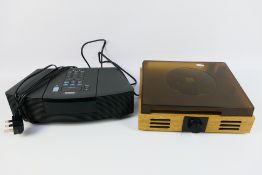 A Bose Wave Radio / CD system and a reco