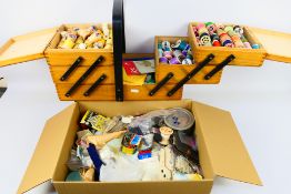 A cantilever sewing box and contents and