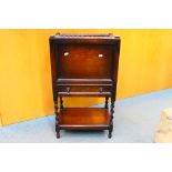 An antique pot cupboard with sliding top section for access, single door and under tier,