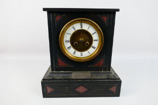 A Victorian black slate and red marble mantel clock, Roman numerals to a white chapter ring,