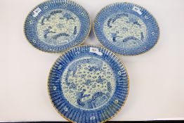 Three Chinese blue and white plates with fluted rim,
