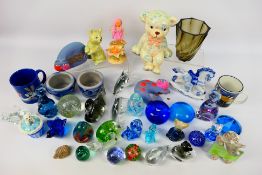 A collection of paperweights, a quantity of ceramics and other.