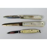 Two silver and mother of pearl folding knives, largest 11.5 cm (l) when opened and one similar.