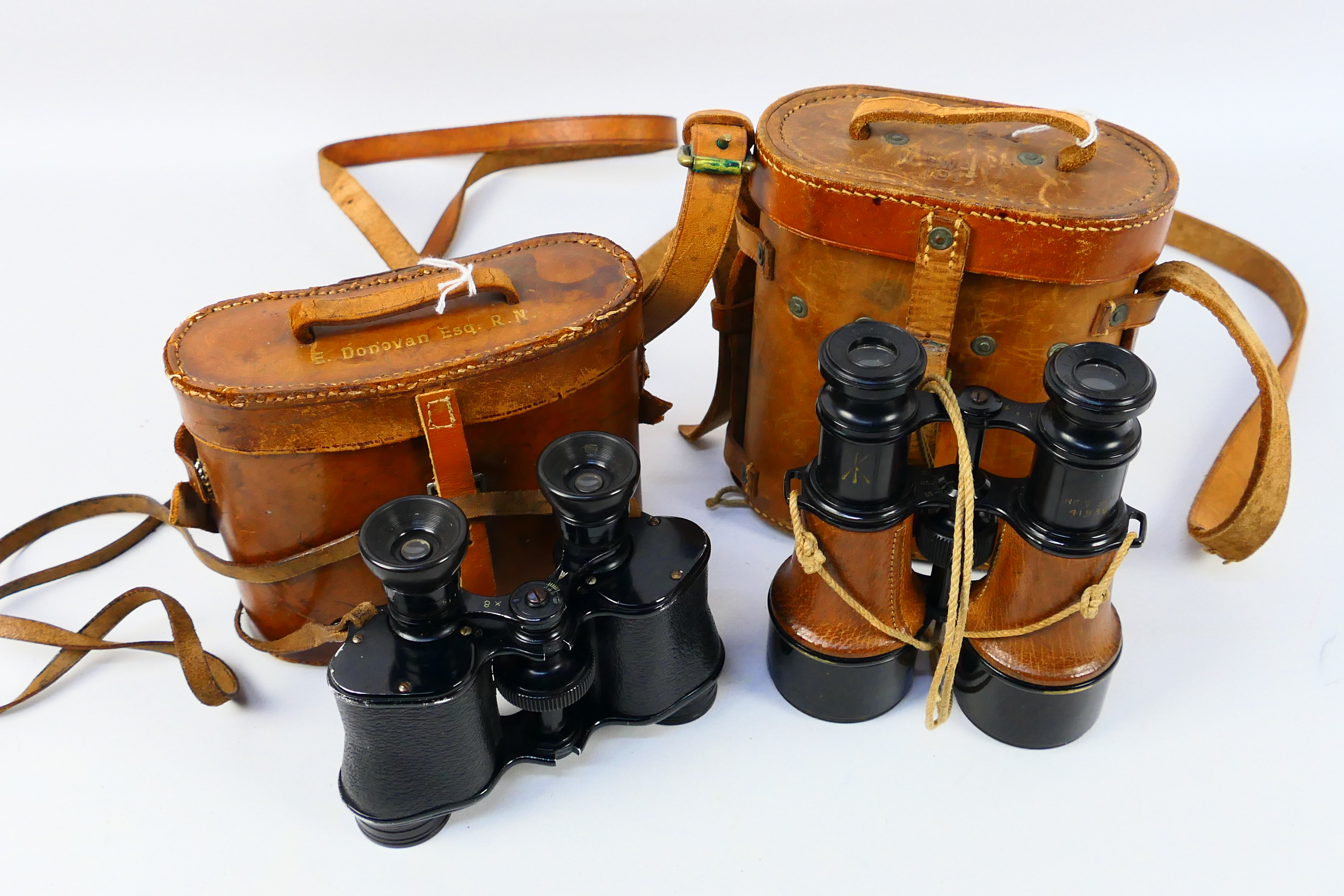 A pair of binoculars marked E Donovan Esq R.