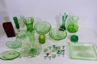 A quantity of predominantly green glassware to include green finger vase, Art Deco Bagley glass,