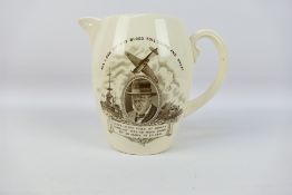 A Copeland Spode commemorative jug, with black transfer decoration depicting Winston Churchill,