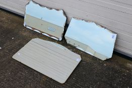 Three vintage wall mirrors, largest approximately 49 cm x 74 cm.
