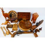 A collection of various treen to include animal carvings, stationary organiser, bowls and similar.