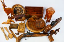A collection of various treen to include animal carvings, stationary organiser, bowls and similar.