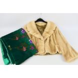 A lady's short fur jacket, 47 cm (l) from collar to hem, and Japanese floral decorated textile.