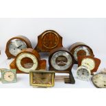 A collection of various clocks and clock parts.