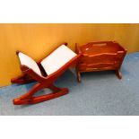 A wooden magazine rack and a wooden rocking foot stool.