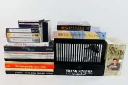 A collection of vinyl, cassettes and com