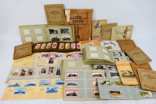 A collection of cigarette card albums to