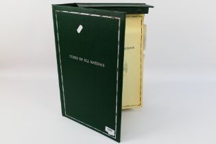 A Franklin Mint binder containing a quan