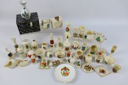 A collection of crested ware to include
