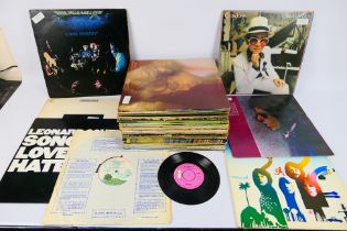 A collection of 12" vinyl records to inc