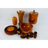 A collection of treen to include vases,