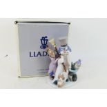 Lladro - A boxed figure group entitled T