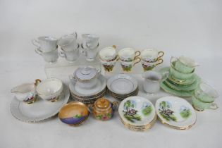 A collection of mixed tea wares to include Royal Imperial Bone China decorated with fox hunting