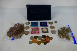 A quantity of UK coins, commemorative crowns and similar, a small quantity of tokens,