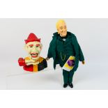 A cast iron Humpty Dumpty style mechanical money bank in the form of a clown and a Wizard Of Oz