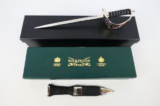 A boxed Wilkinson Sword sgian dubh and a boxed miniature sword.