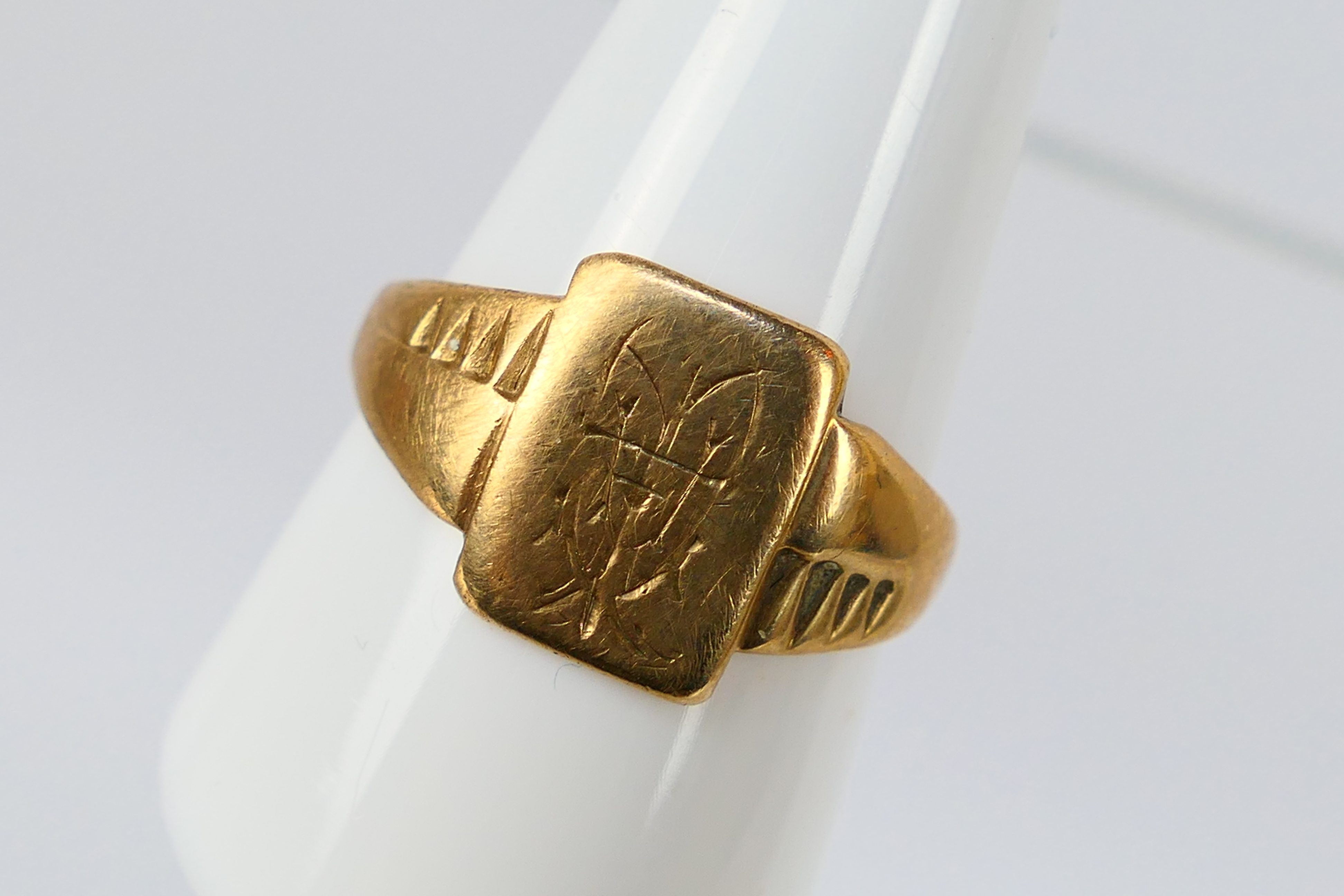 A 9ct gold ring (shank misshapen), 3.8 grams.