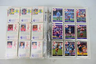 A binder of Merlin Rugby League trade cards.