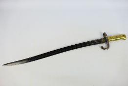 A French M. 1866 bayonet, 57 cm (l) blade, approximately 69 cm (l) overall.