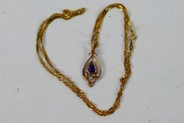 A rose metal pendant set with amethyst with chain stamped 14k, 40 cm (l), approximately 2.