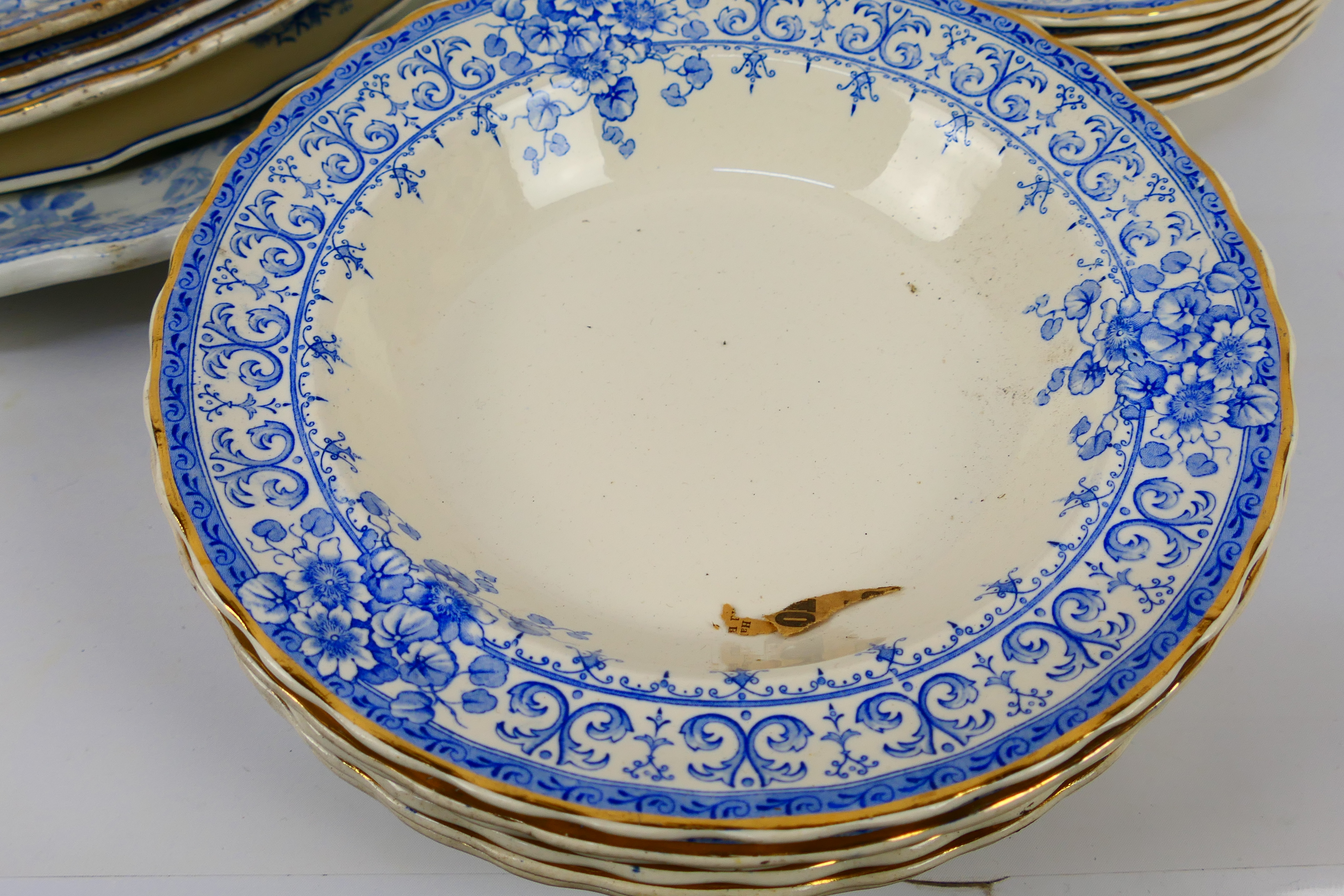 A collection of antique blue and white dinner wares. - Image 3 of 8