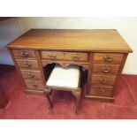 A good period pedestal desk with central drawer above kneehole flanked by two columns each of four