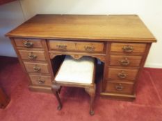 A good period pedestal desk with central drawer above kneehole flanked by two columns each of four