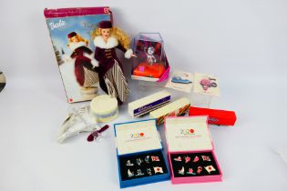 Lot to include a boxed Mattel Barbie Victorian Ice Skater, a small quantity of truck trailer models,