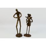 A pair of bronze figures / groups, unsigned, largest approximately 28 cm (h). [2].