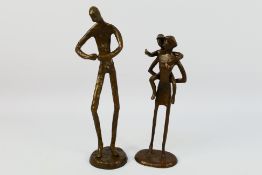 A pair of bronze figures / groups, unsigned, largest approximately 28 cm (h). [2].