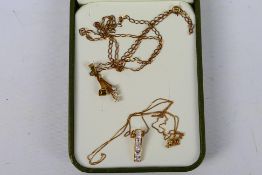 Two yellow metal necklaces with stone set pendants, variously stamped 375 / 9ct / 9k,
