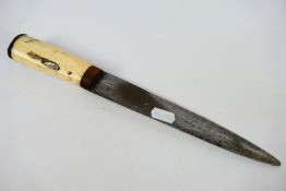 A bone handled dagger with 21 cm (l) blade.