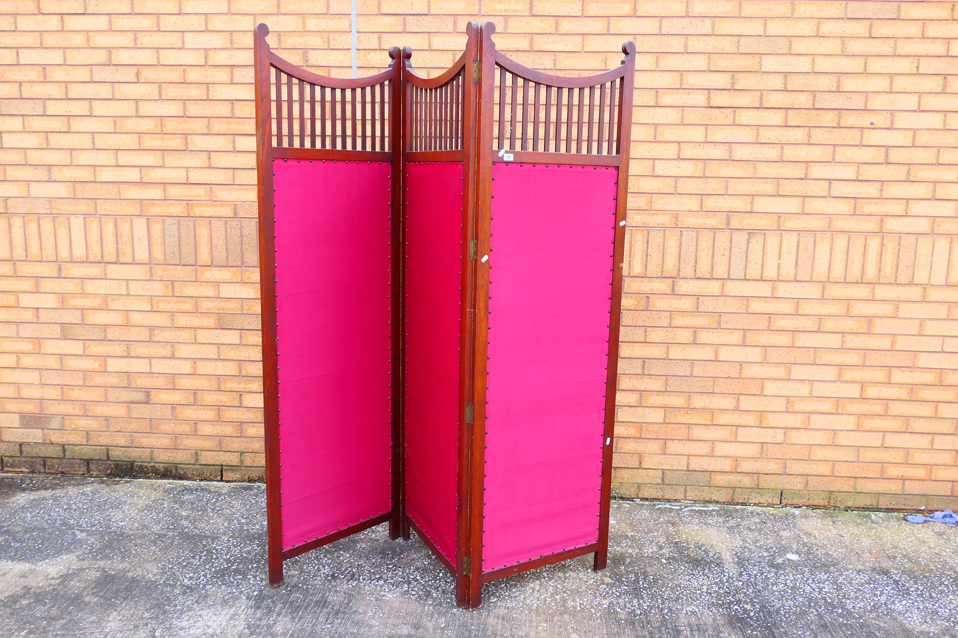 A three fold wood and upholstered screen / room divider, each panel approximately 195 cm x 61 cm.